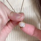 Animated spinning Luna moonstone fidget necklace, showcasing its movement for anxiety relief